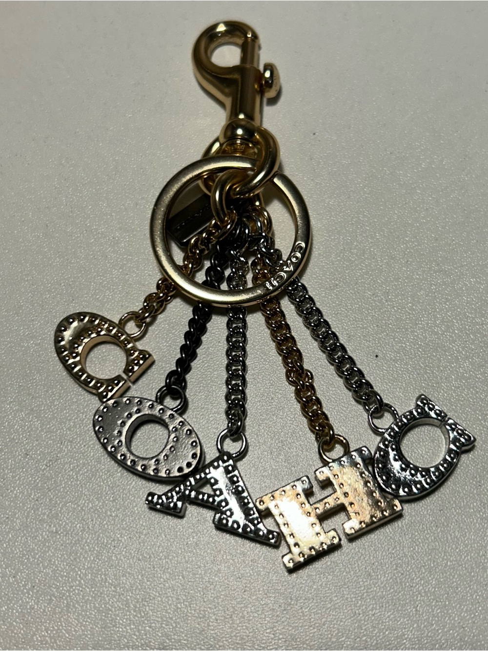 Coach Perforated "COACH" Letters Multicolor Metal Bag Charm With Dust Bag